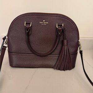 Kate Spade Pebbled Leather McCall Street Carli Plum Doom Satchel with Tassel